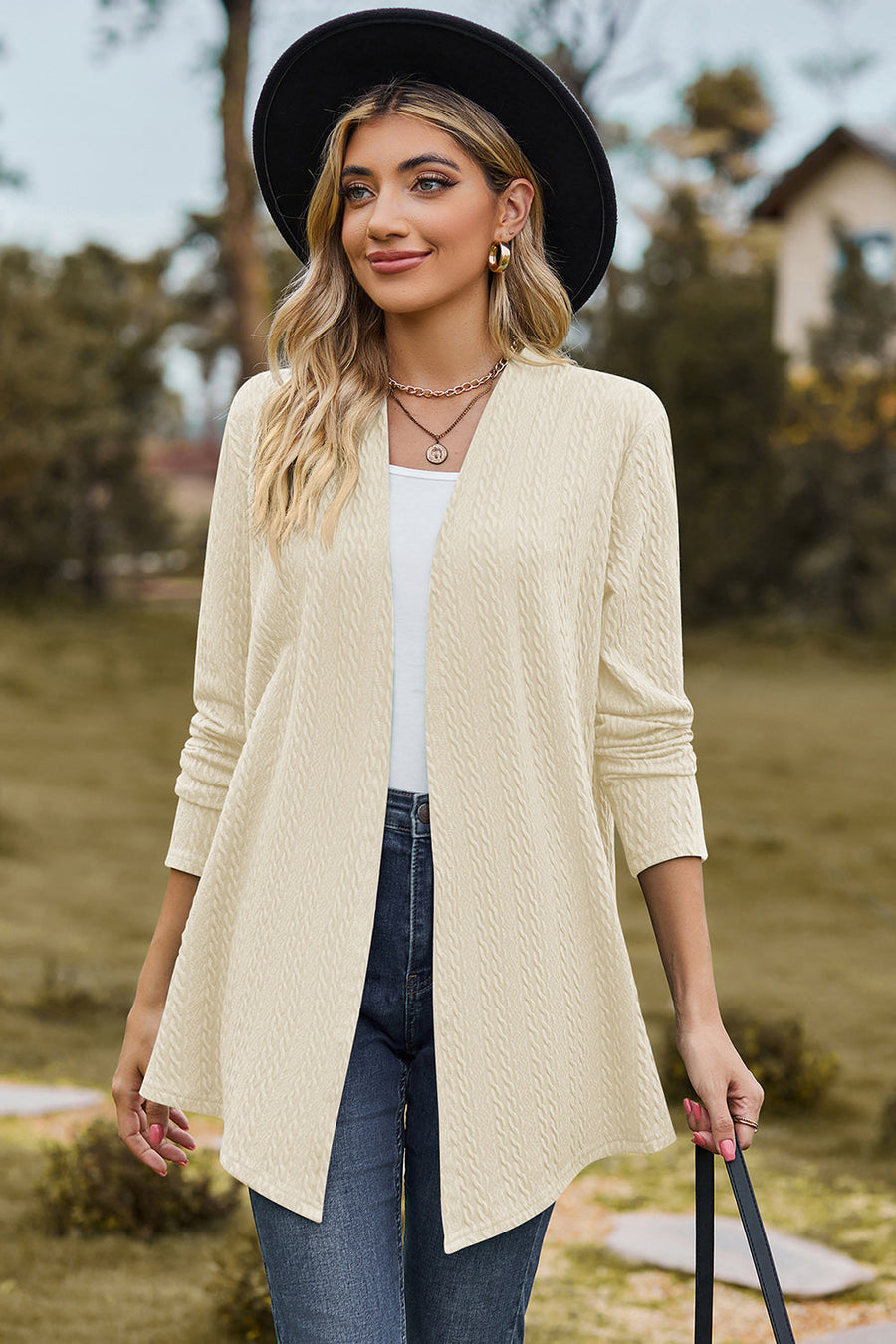 Cream textured open-front drape cardigan with long sleeves and a relaxed fit.