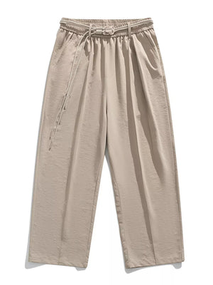 Belted relaxed fit khaki sweatpants with drawstring and buckle closure.
