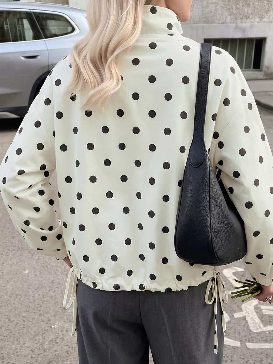 cream windbreaker with hip-length and button-front