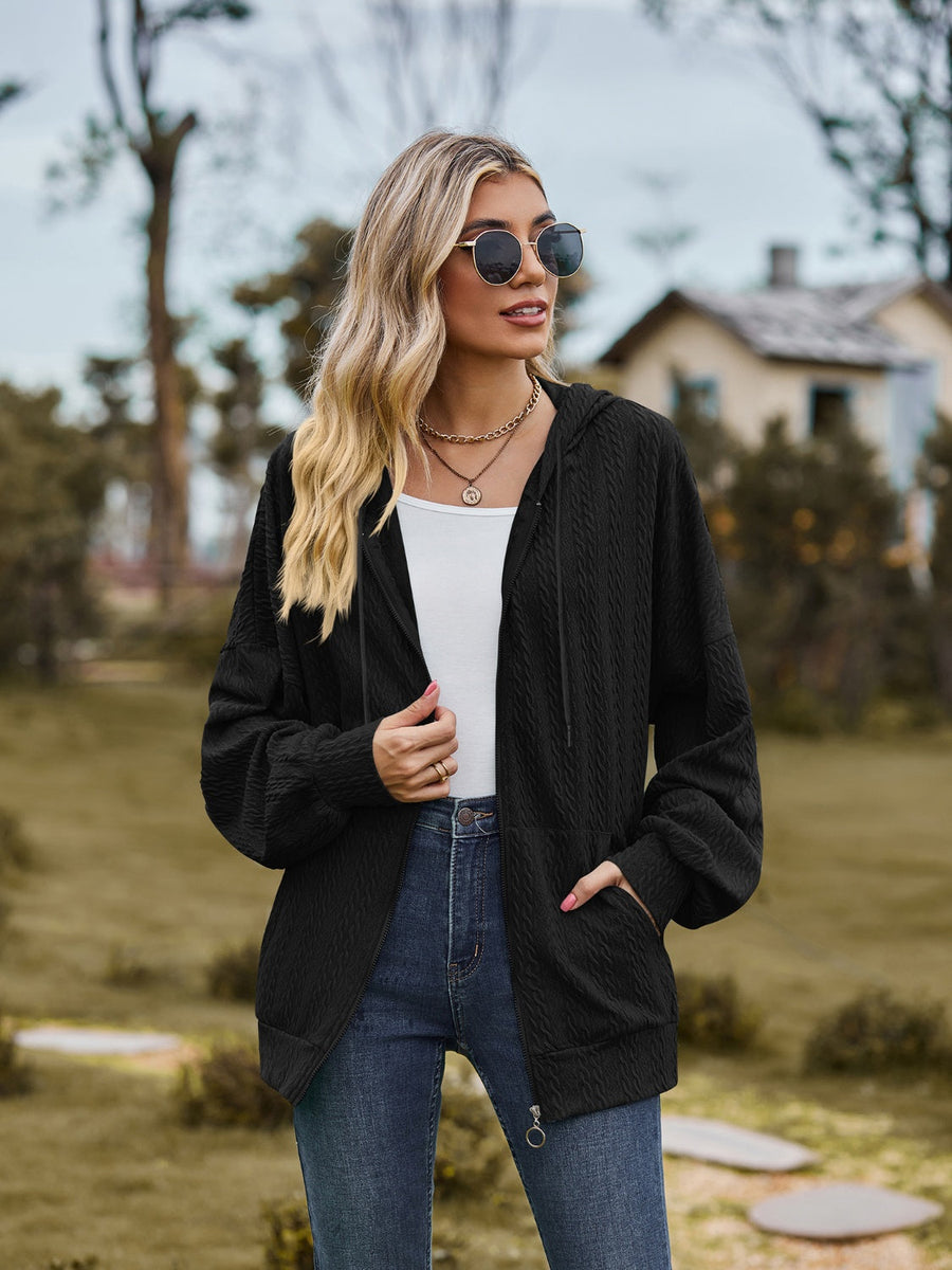 Black textured knit dolman sleeve zip-up hoodie with drawstring hood and pockets.