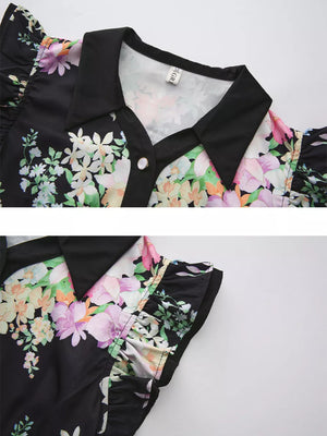 Black floral midi dress with ruffle sleeves, collared neckline, and button detail.