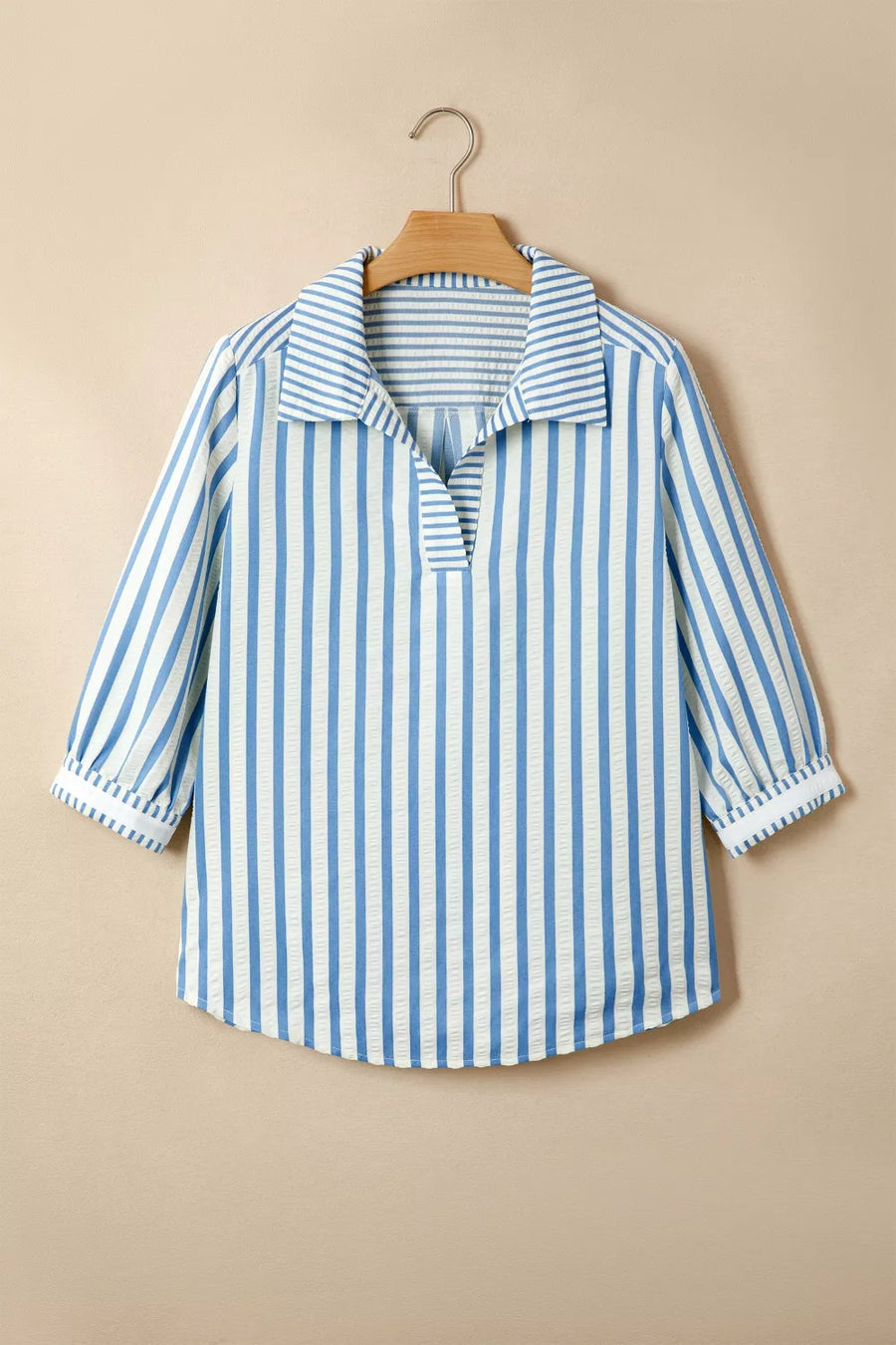 Blue and white striped collared blouse with textured fabric and 3/4 sleeves.