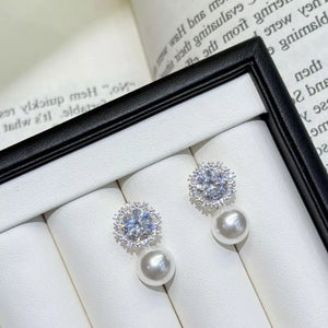 earrings in white with zircon embellishment and short drop