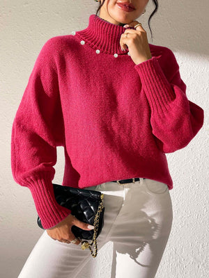 Deep Red knit sweater with pearl details on the turtleneck and dolman sleeves.