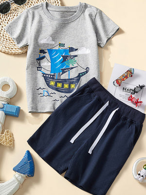 Toddler grey cotton tee with sailing ship graphic and navy elastic waist shorts.