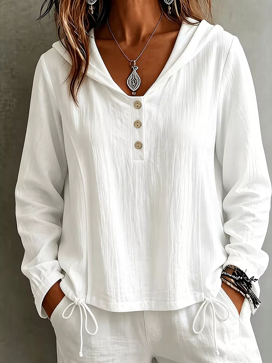 blouse in white featuring buttoned and relaxed fit