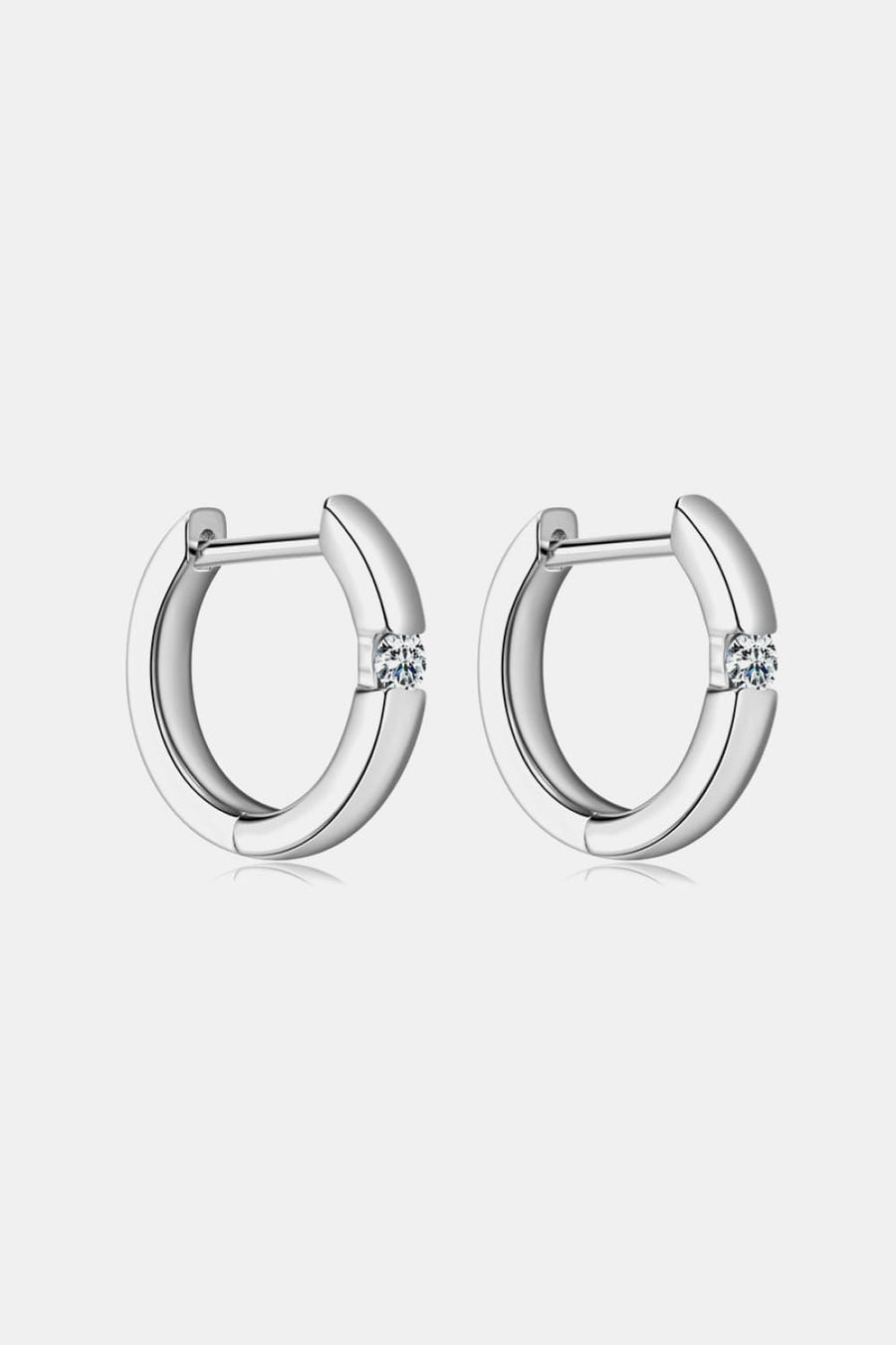 Silver pavé point huggie hoop earrings with a single stone detail