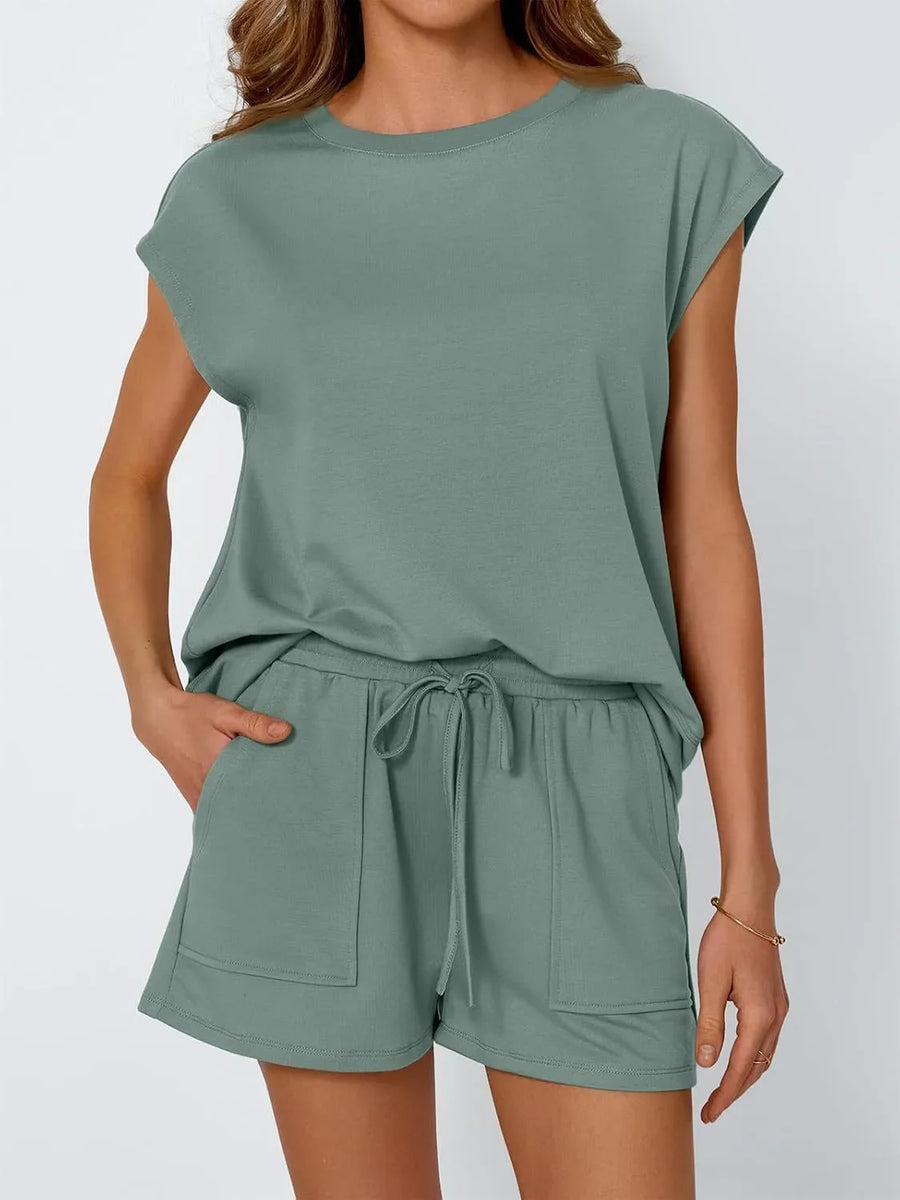 Relaxed fit drawstring short set in sage green with cap sleeves and patch pockets.