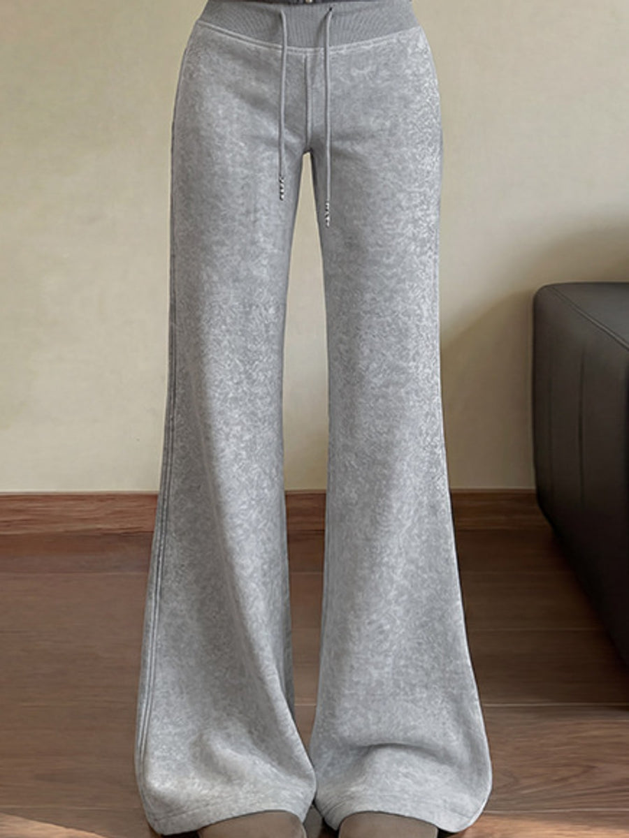 flare pants in light gray featuring drawstring waist and flared fit