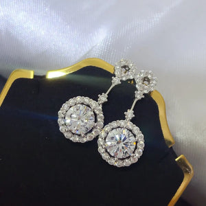 earrings in silver with drop design and dangle