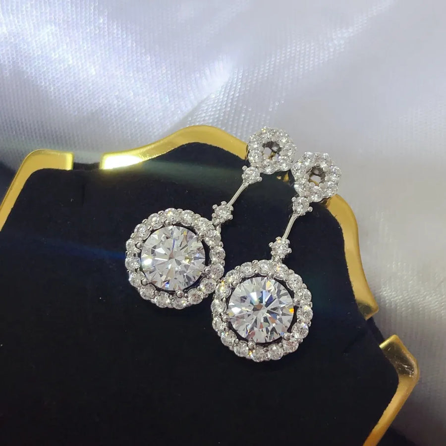 earrings in silver with drop design and dangle
