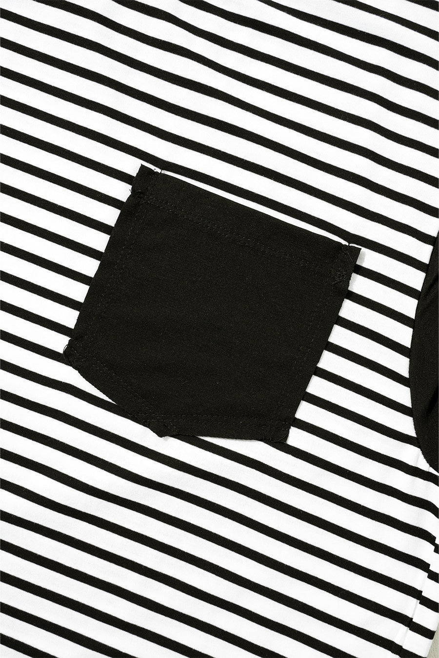 Black and white striped t-shirt with a black chest pocket detail.