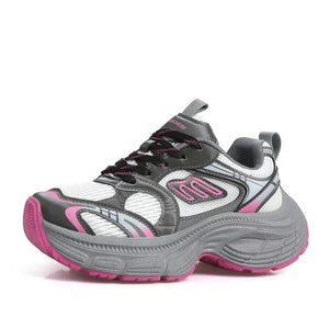 Chunky retro runner sneakers in white with hot pink and grey accents and a thick sole.