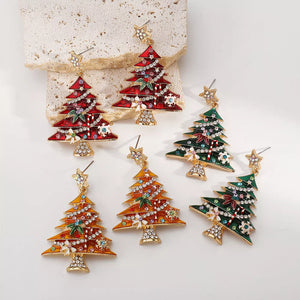 Enchanted Holiday Tree Earrings in red, yellow, and green with star tops and festive details.