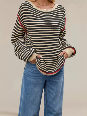 100% Acrylic Care instructions: Machine wash cold pullover sweater in Navy Blue with oversized silhouette