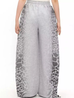 Men's grey cotton sweatpants with leopard print side panels and drawstring waist.