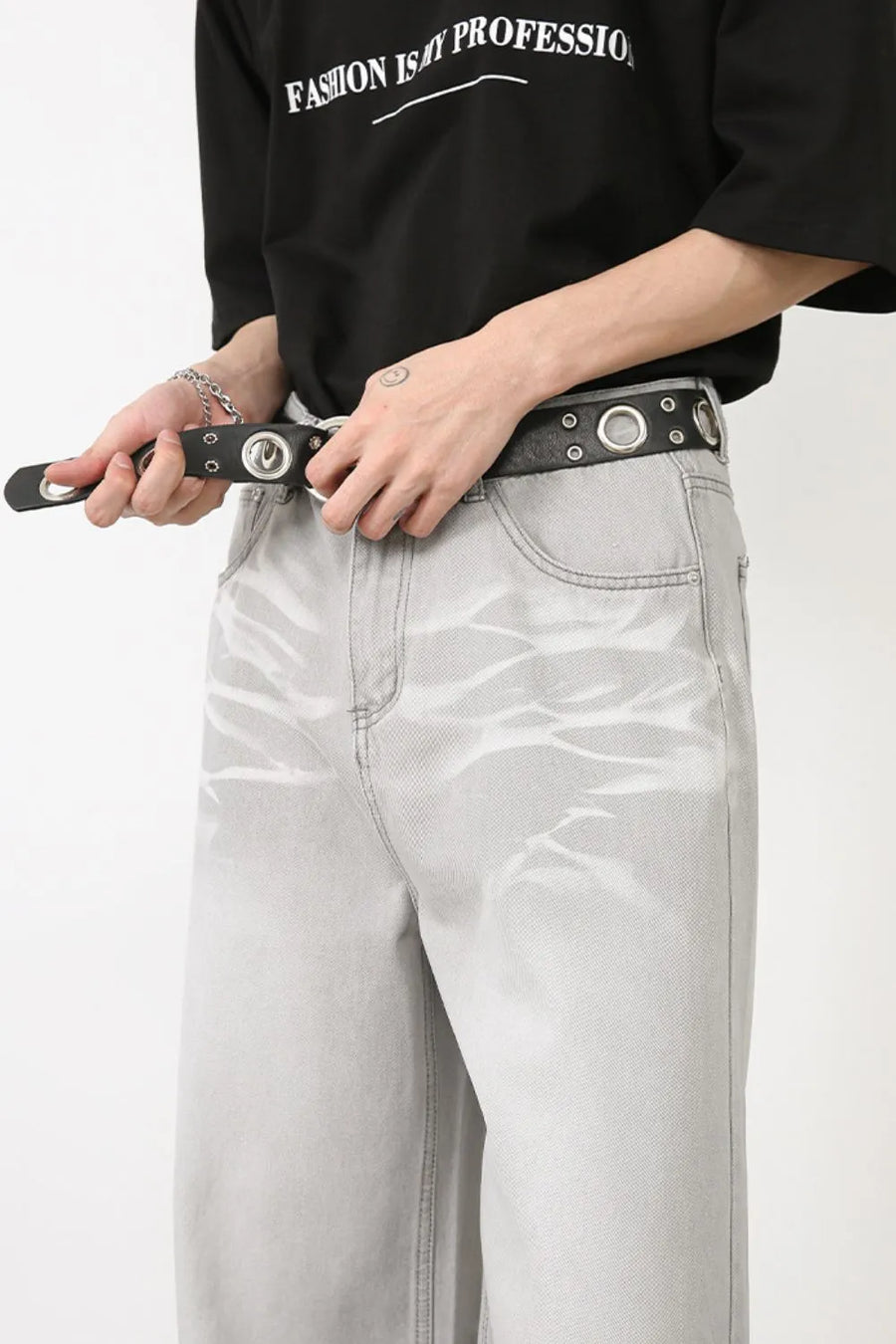 Gray bleached wash wide-leg denim trousers with a subtle wave pattern.