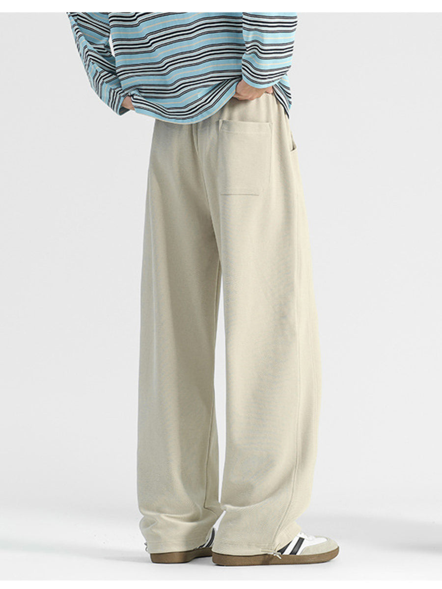 Beige wide leg sweatpants with a single back pocket