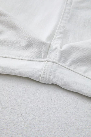 White denim jeans showing inseam and hem detail