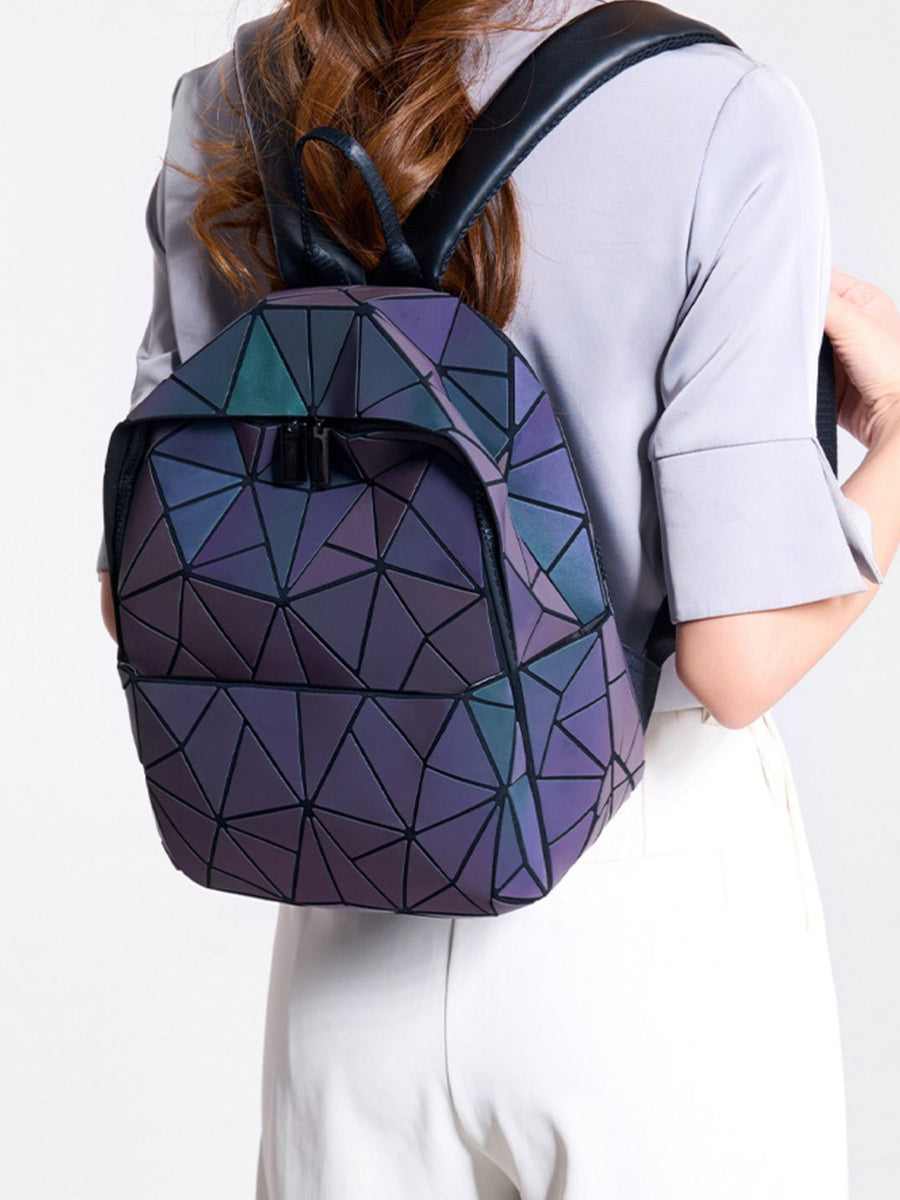 backpack in black with geometric and adjustable straps