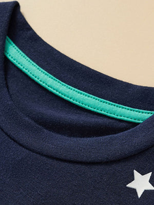 Children's dark navy crew neck t-shirt with a white star detail and green trim.