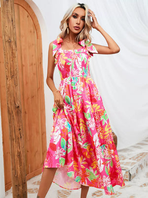 Tropical tie-strap smocked midi dress in strawberry with a vibrant floral print and tiered skirt.
