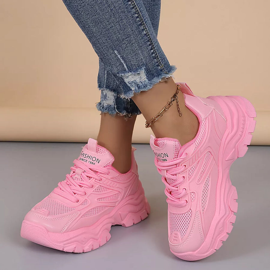 athletic shoes in pink featuring round toe and chunky platform fit