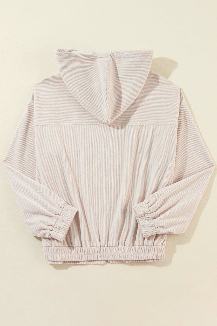 Cream corduroy bomber hoodie with relaxed fit, elastic cuffs and hem