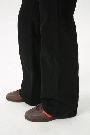 Black denim jeans with panel seam flare detail and a relaxed fit.
