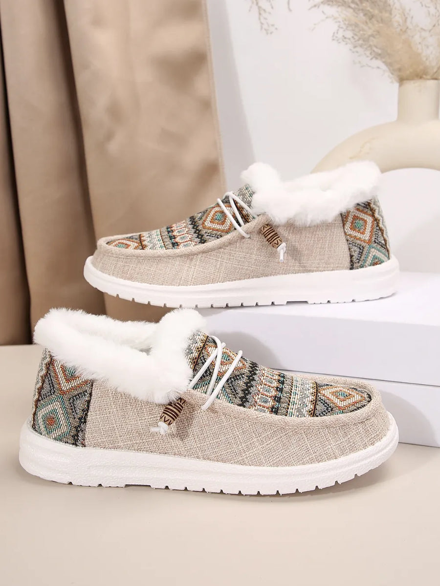 Southwestern print faux fur lined loafers in taupe with white laces and trim.