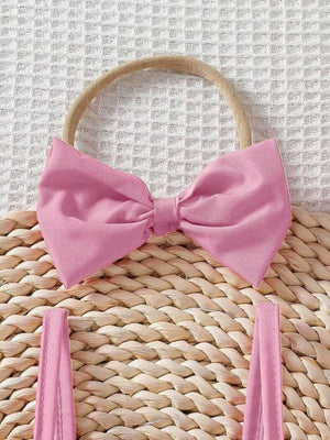 Baby pink cotton bow headband and matching ruffle top straps.