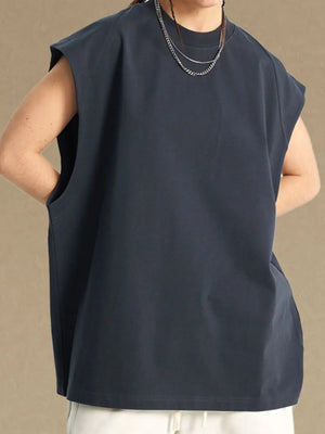 Raglan shoulder sleeveless top in dark gray with crew neck and pockets.