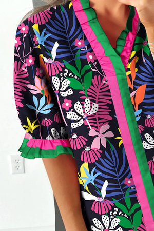 Floral frill v-neck shirt with striped accents and ruffled sleeves.
