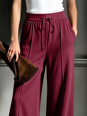 wide-leg pants in Black with tied and full-length