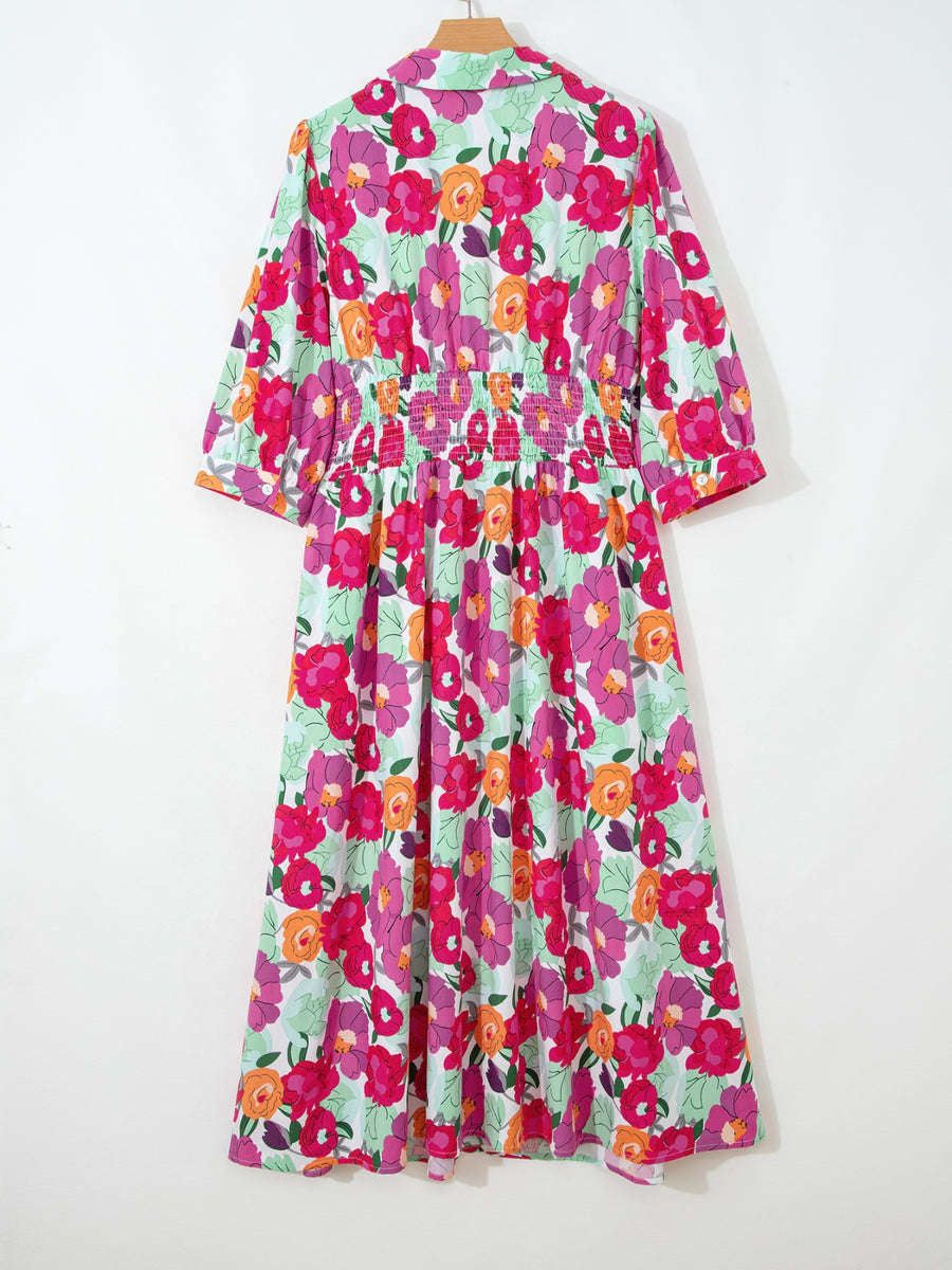 Floral V-neck cotton midi dress with smocked waist and 3/4 sleeves.