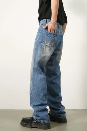 Baggy medium wash denim jeans with vintage fade detail.