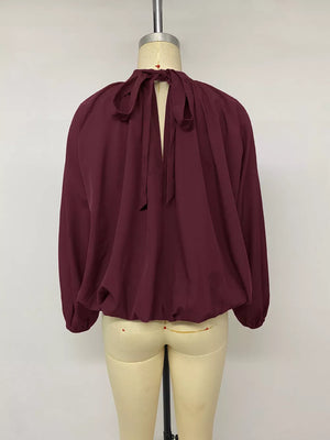 blouse in Fuchsia Pink with tied back and hip-length