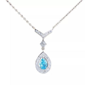 light blue necklace featuring teardrop pendant and geometric