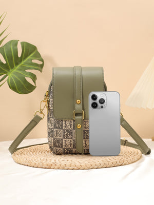 crossbody bag in sage green with geometric and flap closure