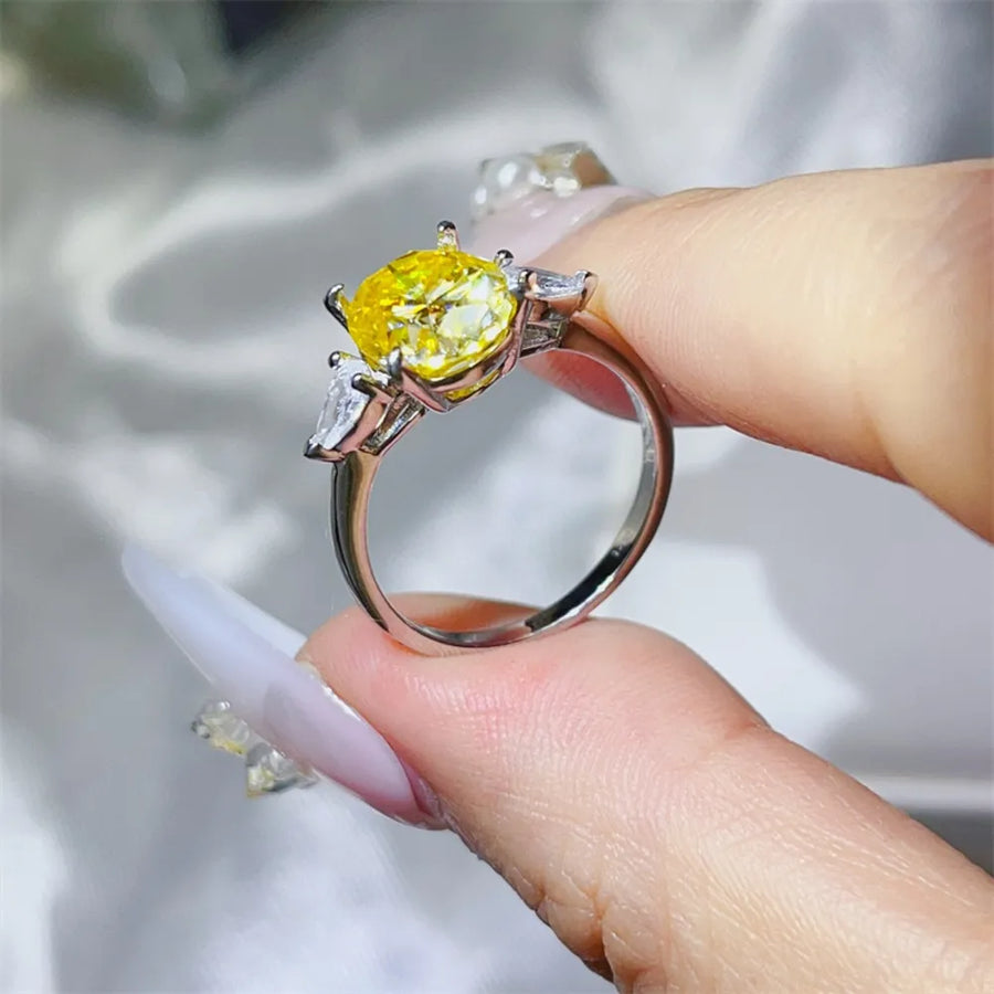 Platinum-plated, 925 sterling silver, Moissanite, Zircon (accent stones) Carat w ring in Pastel Yellow with three-stone
