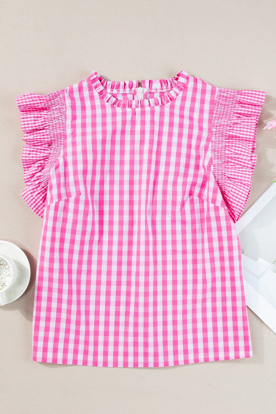 Fuchsia pink gingham blouse with mock neck and ruffled short sleeves.