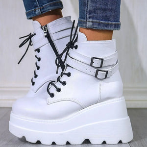 White platform buckle lace-up booties with side zipper and chunky sole.