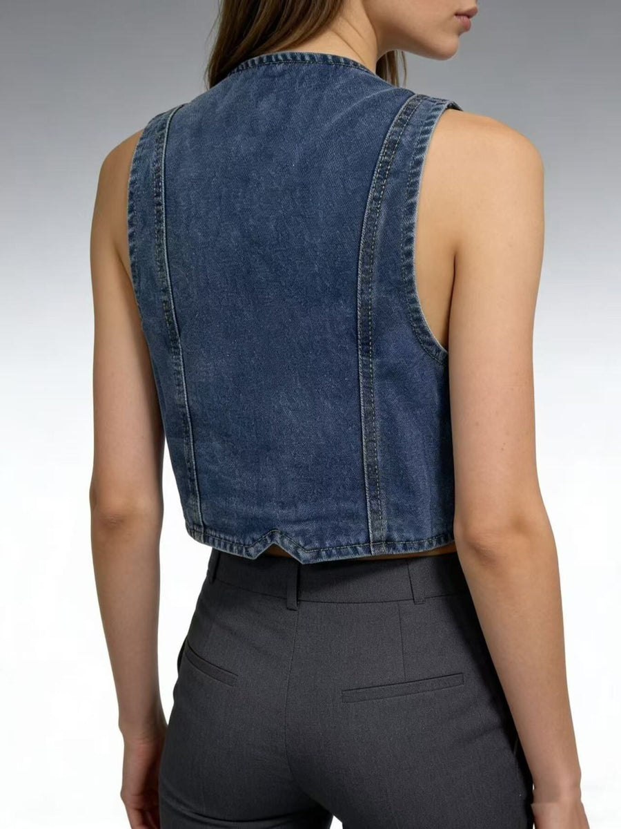 Chic button-down denim vest in dark blue, cropped length, cotton.