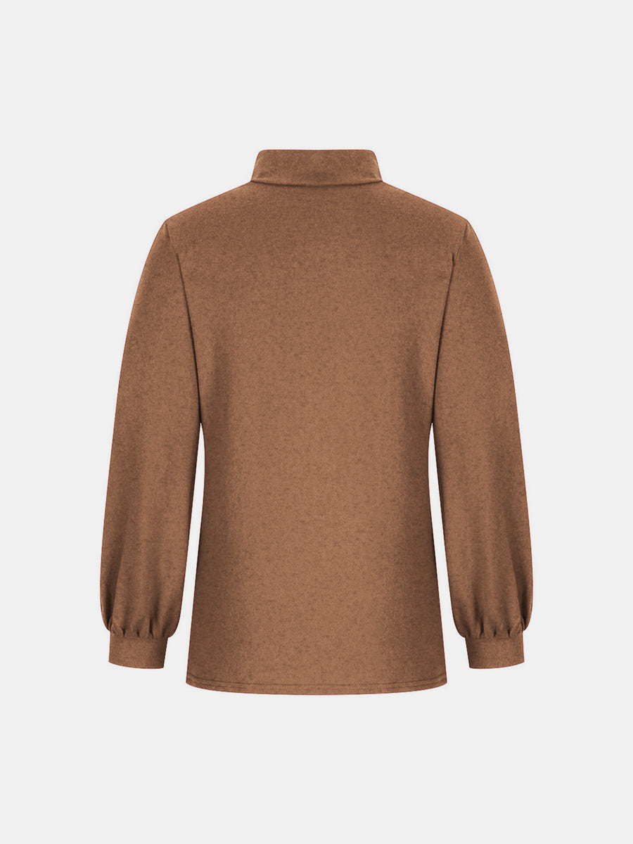 Camel button-back mock neck top with puff sleeves.