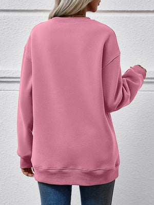 Blush Pink polyester drop shoulder sweatshirt with crew neck and cuffed hem.
