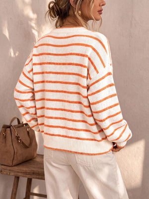 White and orange striped knit sweater with long sleeves