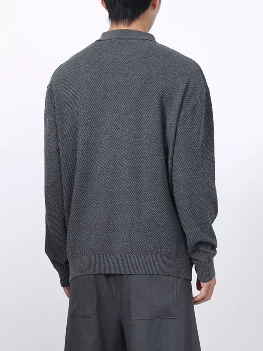 Men's dark gray textured knit polo with long sleeves and a classic collar.