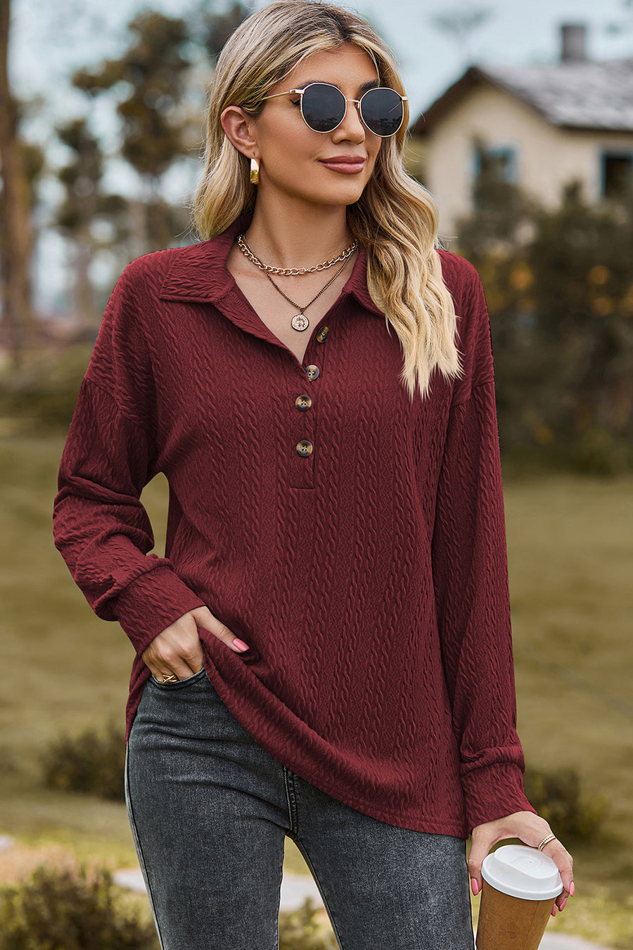 Burgundy textured polo-neck sweater with button detail and long sleeves.