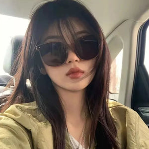 sunglasses in black featuring UV400 protection and oversized fit