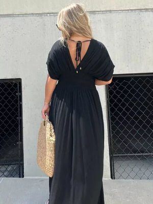 Black V-neck maxi dress with dolman sleeves and smocked waist, tied back detail